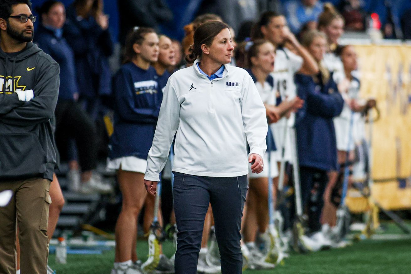 Marquette women’s lacrosse head coach Meredith Black on the sideline during a game.