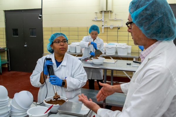 Instructor and student work in chocolate laboratory in Babcock Hall, Aug. 2, 2024.