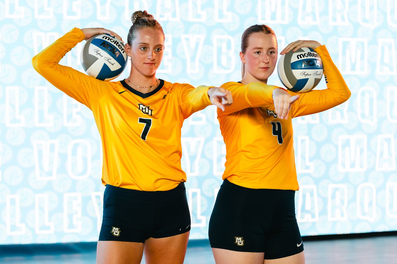 Marquette volleyball’s Ella Foti & Jenna Reitmsa pose during a video shoot