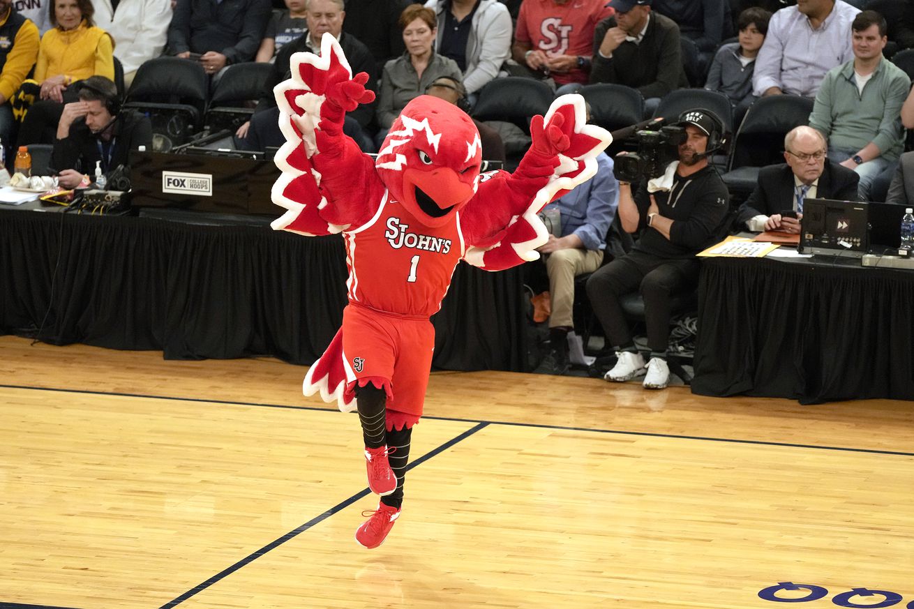 The St. John’s Red Storm mascot performs during a basketball game.