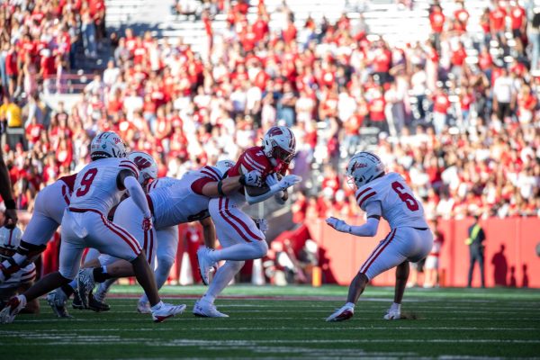 Badger Running back Dilin Jones powers through South Dakota defenders. Sept. 7, 2024. 