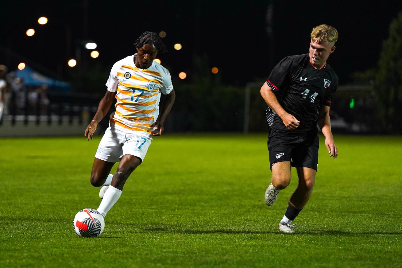 Marquette’s Abdoul Karim Pare plays the ball against Edgewood.