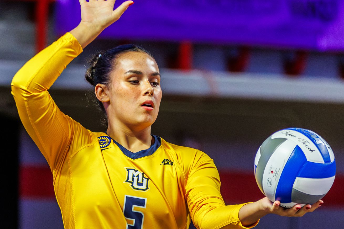 Marquette’s Calli Kenny prepares to serve against #24 Dayton.