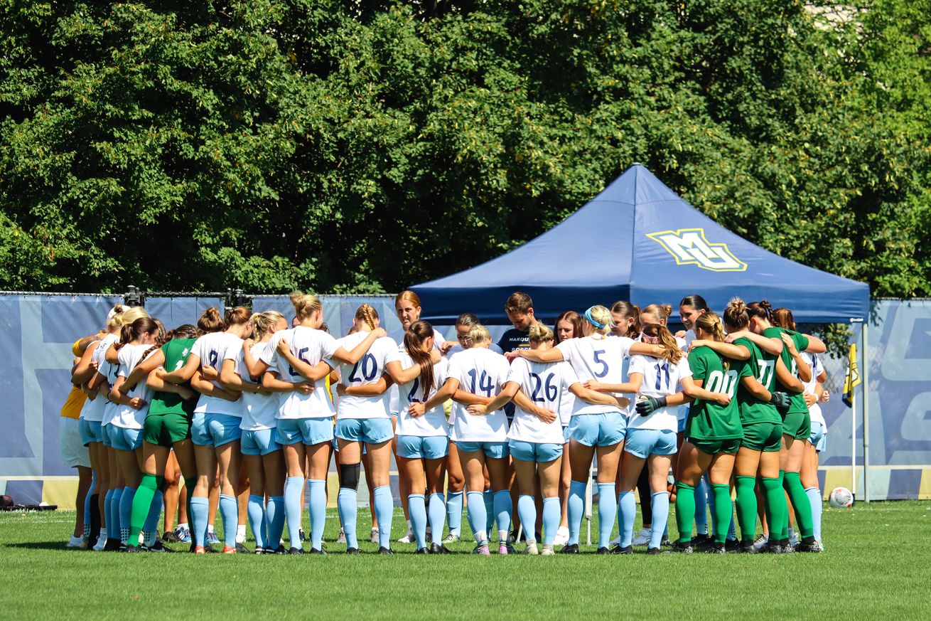 Marquette women’s soccer huddles up during a match against Minnesota.