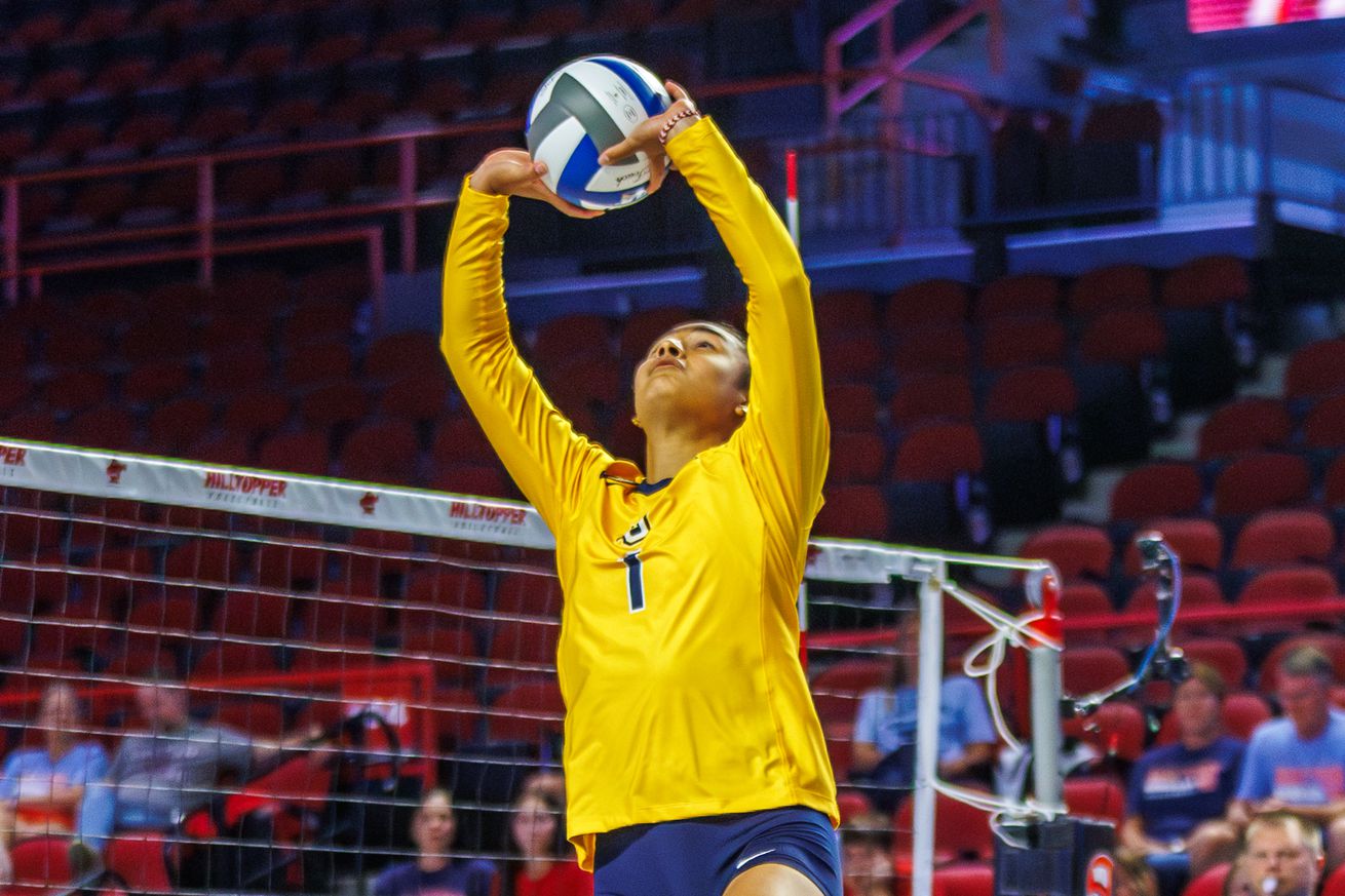 Marquette’s Yadhira Anchante setting a ball against #24 Dayton.