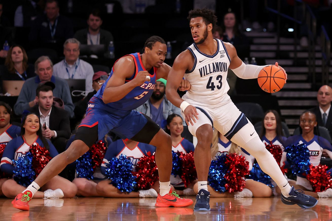 Villanova Wildcats forward Eric Dixon (43) controls the ball against DePaul Blue Demons center Churchill Abass (5) during the first half at Madison Square Garden.