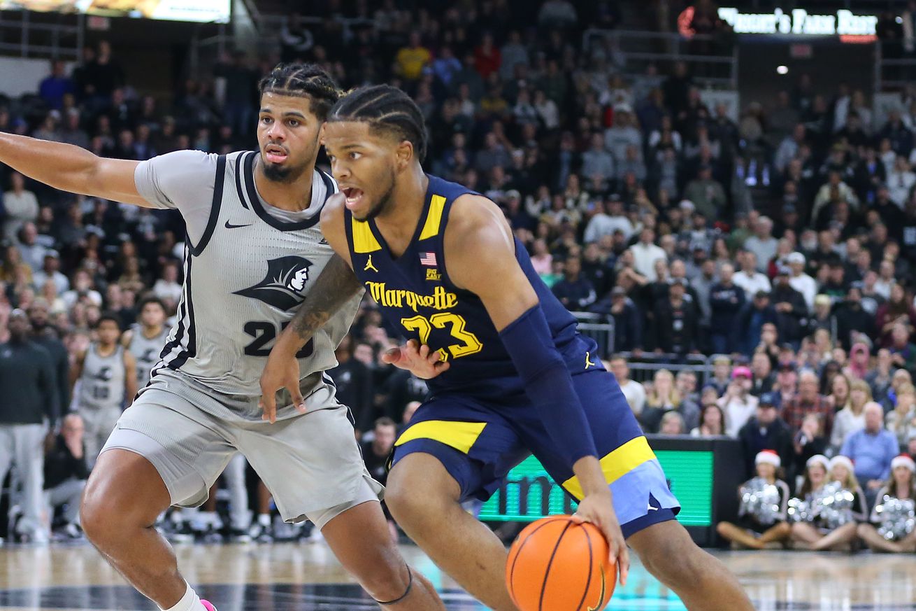 Marquette Golden Eagles forward David Joplin (23) and Providence Friars forward Bryce Hopkins (23) in action during the college basketball game between Marquette Golden Eagles and Providence Friars on December 20, 2022, at Amica Mutual Pavilion in Providence, RI.