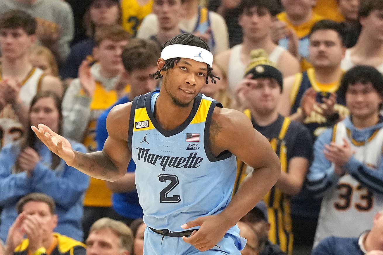 Chase Ross #2 of the Marquette Golden Eagles celebrates a shot during a college basketball game against the Texas Longhorns at the Fiserv Forum on December 6, 2023 in Milwaukee, Wisconsin.