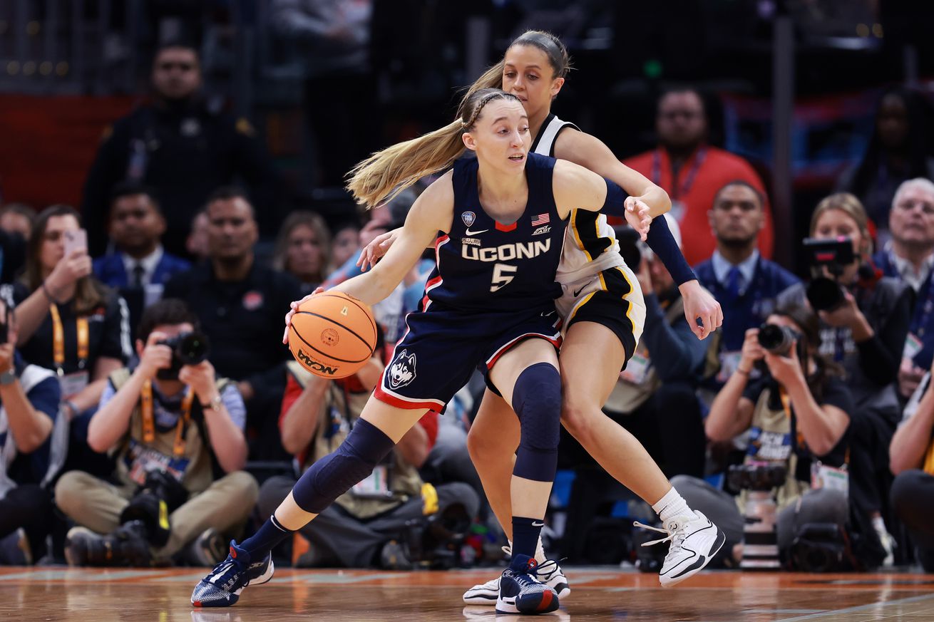 Paige Bueckers #5 of the UConn Huskies with the ball in the first half during the NCAA Women’s Basketball Tournament Final Four semifinal game against the Iowa Hawkeyes at Rocket Mortgage Fieldhouse on April 05, 2024 in Cleveland, Ohio.