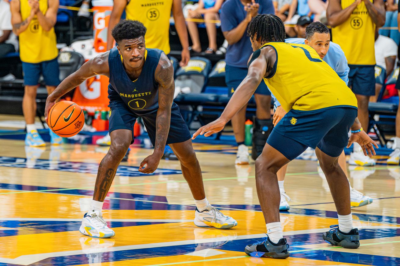 Marquette’s Kam Jones and Chase Ross squaring off at August’s open scrimmage.