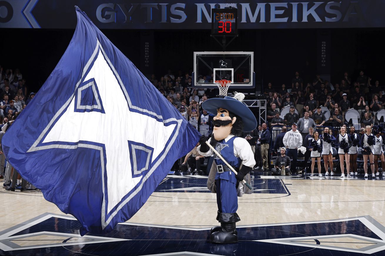 Xavier Musketeers mascot D’Artagnan holds the school flag at mid-ourt before a college basketball game against the Villanova Wildcats at Cintas Center on February 7, 2024 in Cincinnati, Ohio.