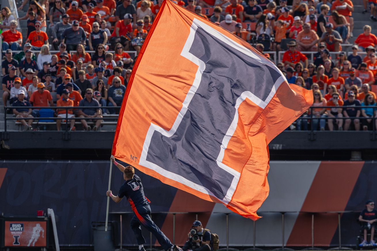 An Illinois Fighting Illini cheerleader is seen during the game against the Purdue Boilermakers at Memorial Stadium on October 12, 2024 in Champaign, Illinois.