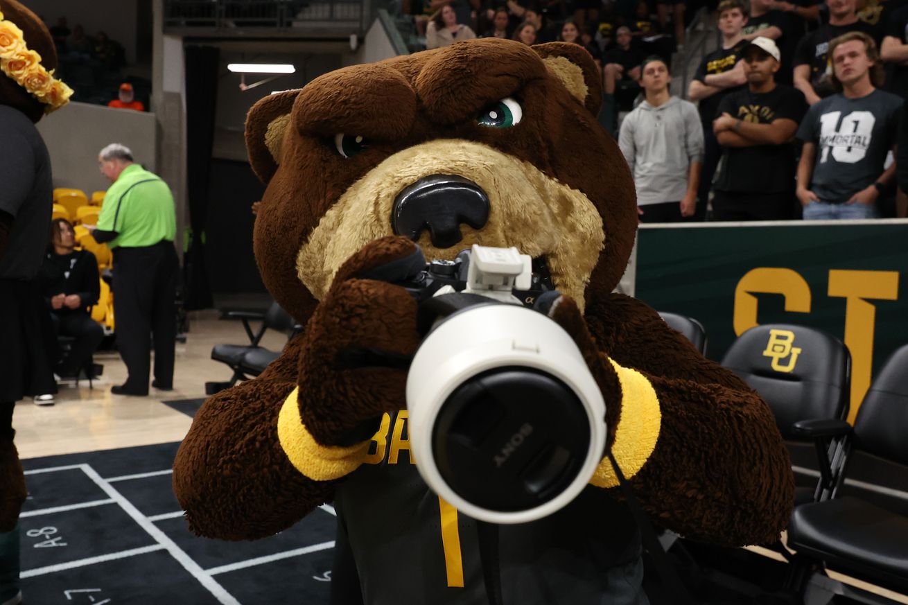 Baylor Bears mascot Bruiser uses a photographer’s camera prior to the game against the Sam Houston State Bearkats at Foster Pavilion on November 12, 2024 in Waco, Texas.