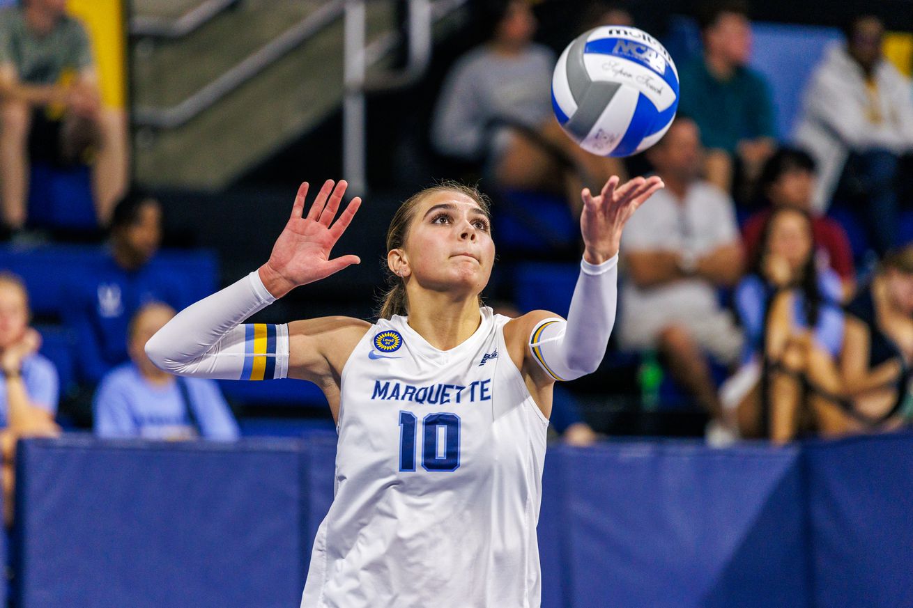 Marquette volleyball’s Aubrey Hamilton preparing to serve the ball.