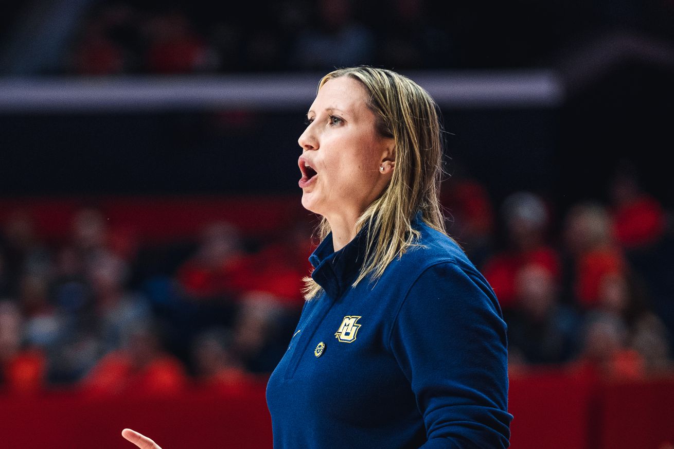 Marquette head coach Cara Consuegra at work on the road against Illinois.