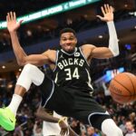 Milwaukee Bucks forward Giannis Antetokounmpo (34) sticks tongue out after dunking