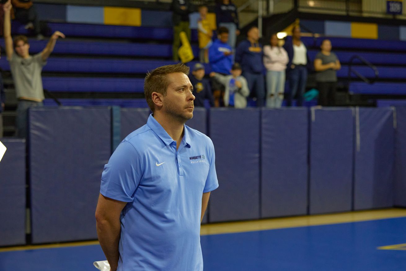 Marquette volleyball head coach Ryan Theis watching the action at the McGuire Center.