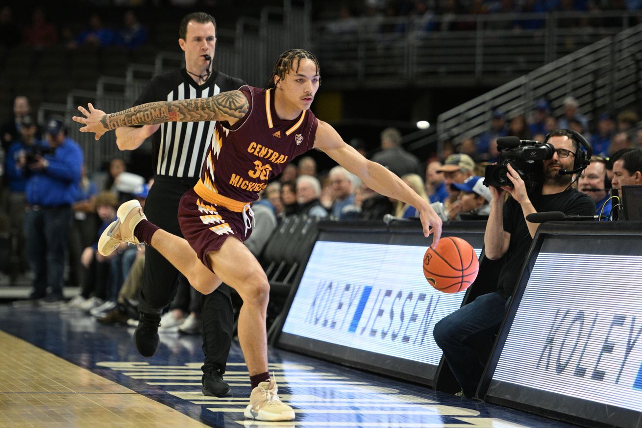 Central Michigan Chippewas guard Anthony Pritchard (30) reaches for a loose ball against the Creighton Bluejays in the first half at CHI Health Center Omaha.