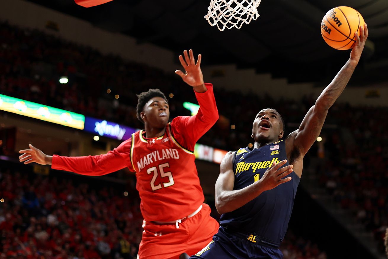 Marquette Golden Eagles guard Kam Jones (1) takes a shot over Maryland Terrapins center Derik Queen (25) during the first half against the at Xfinity Center. 