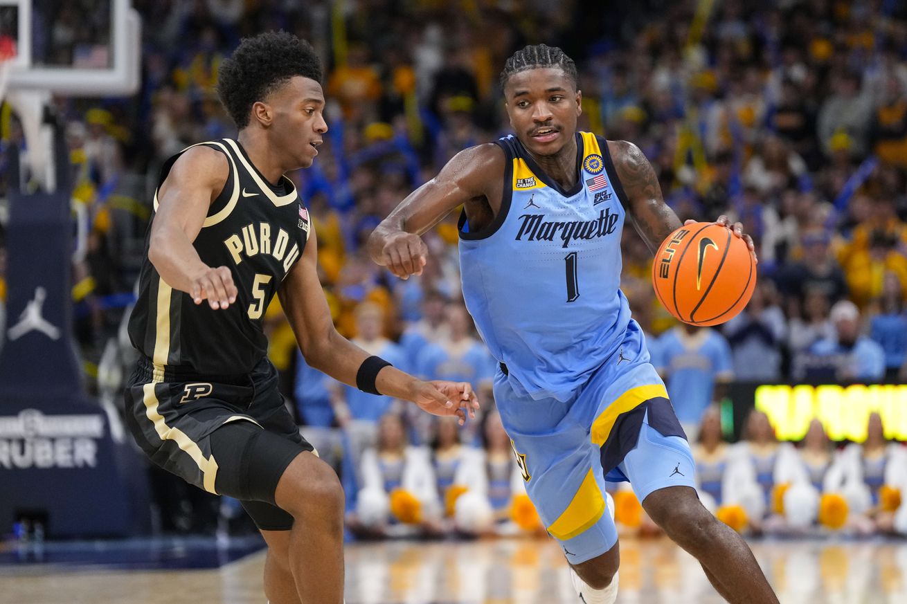 Marquette Golden Eagles guard Kam Jones (1) drives towards the basket against Purdue Boilermakers guard Myles Colvin (5) during the second half at Fiserv Forum.