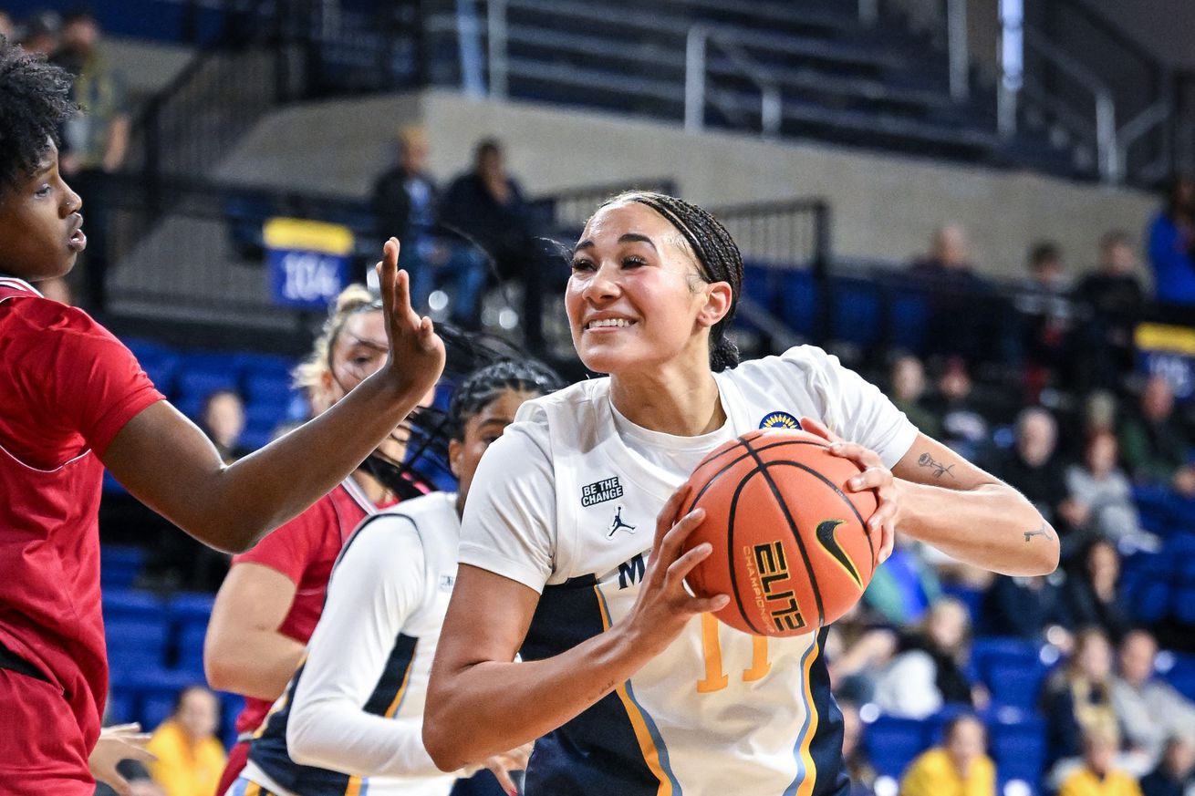 Marquette forward Skylar Forbes (11) goes to the basket against IU Indy forward Jada Patton (24) in the first half of a game Sunday, November 24, 2024, at the Al McGuire Center in Milwaukee, Wisconsin.