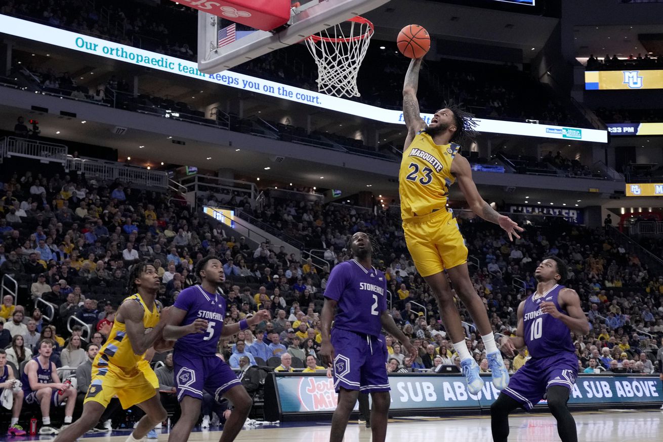 Marquette forward David Joplin (23) throws down a dunk during the first half of their game against Stonehill Wednesday, November 27, 2024 at Fiserv Forum in Milwaukee, Wisconsin.