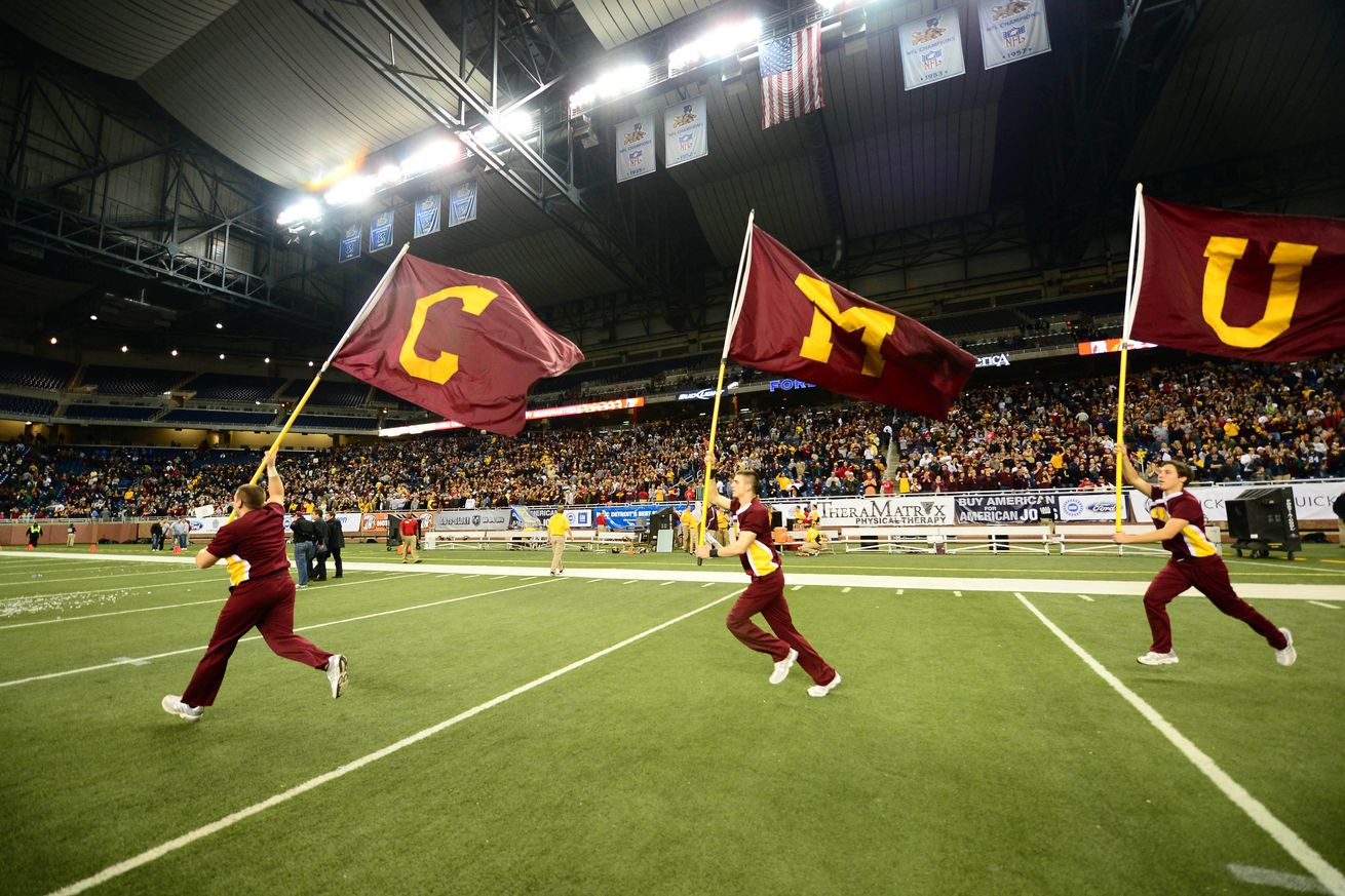 Central Michigan Chippewas cheerleaders wave flags after derating Western Kentucky Hilltoppers 42-21 to win the 2012 Little Caesars Bowl at Ford Field.