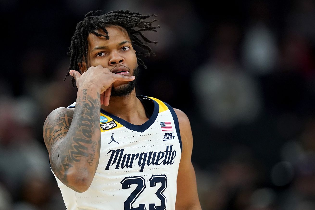 David Joplin #23 of the Marquette Golden Eagles celebrates a three point basket against the Colorado Buffaloes during the first half in the second round of the NCAA Men’s Basketball Tournament at Gainbridge Fieldhouse on March 24, 2024 in Indianapolis, Indiana.