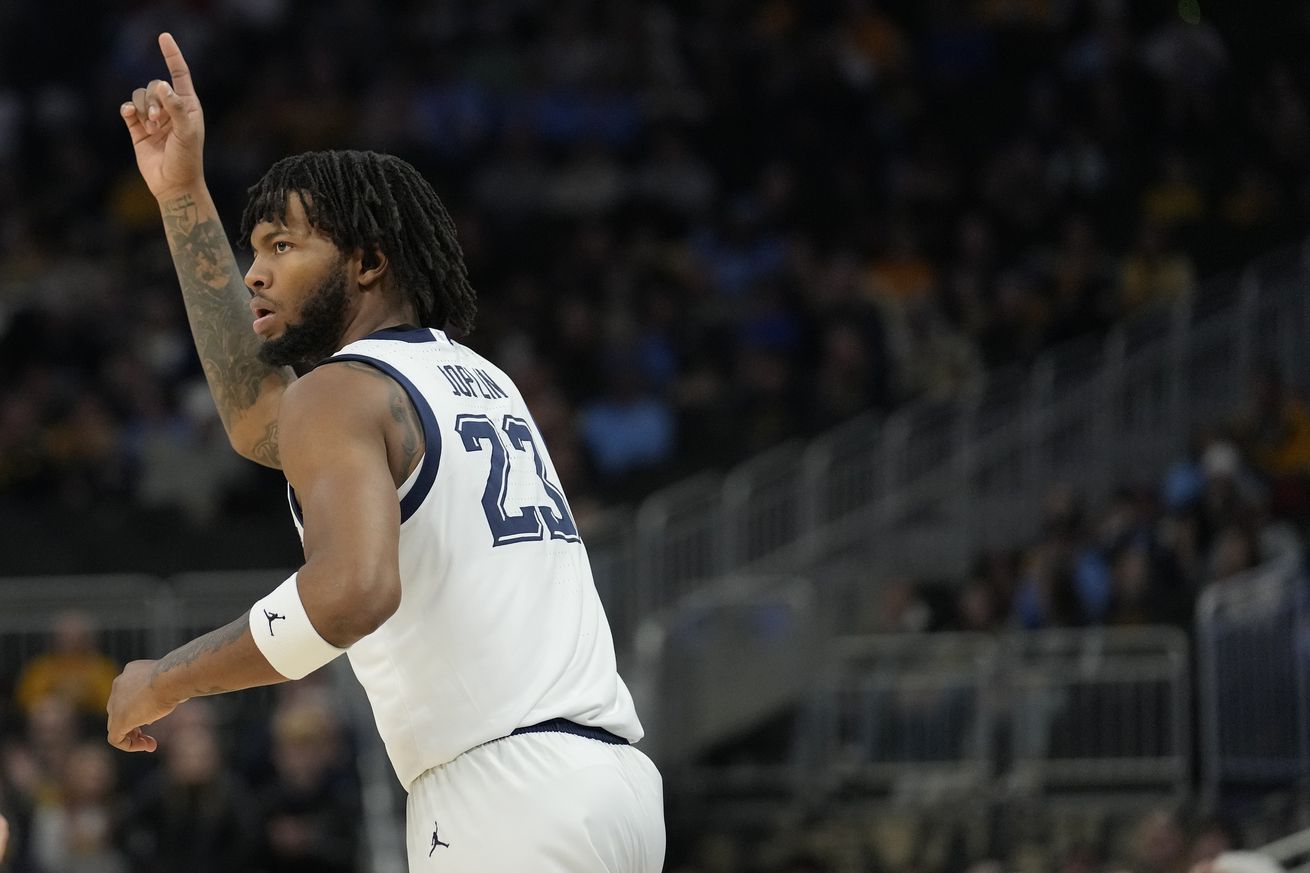 David Joplin #23 of the Marquette Golden Eagles celebrates a three point basket against the Western Carolina Catamounts during the first half at Fiserv Forum on November 30, 2024 in Milwaukee, Wisconsin.