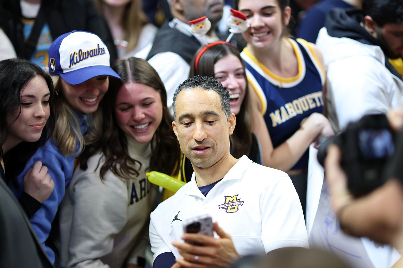 Head coach Shaka Smart of the Marquette Golden Eagles speaks with fans following a game against the Wisconsin Badgers at Fiserv Forum on December 07, 2024 in Milwaukee, Wisconsin. Marquette defeated Wisconsin 88-74.