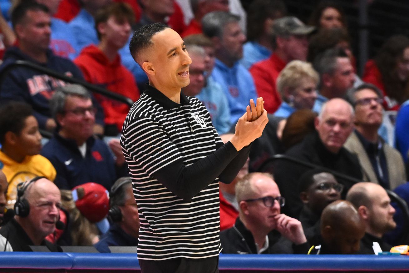 Head coach Shaka Smart of the Marquette Golden Eagles looks for a foul call during the first half of a game against the Dayton Flyers at UD Arena on December 14, 2024 in Dayton, Ohio.