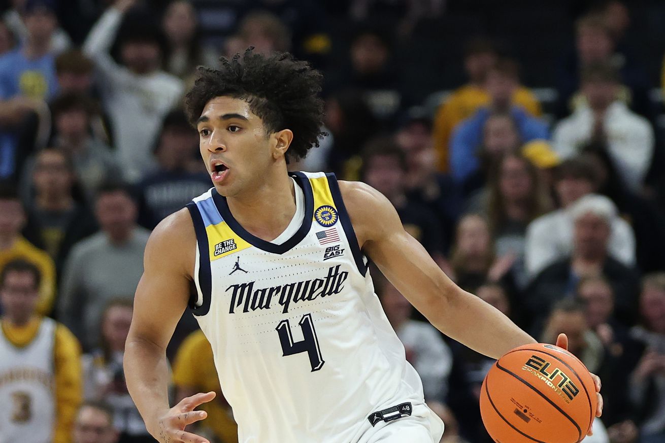 Stevie Mitchell #4 of the Marquette Golden Eagles handles the ball during a game against the Butler Bulldogs at Fiserv Forum on December 18, 2024 in Milwaukee, Wisconsin.