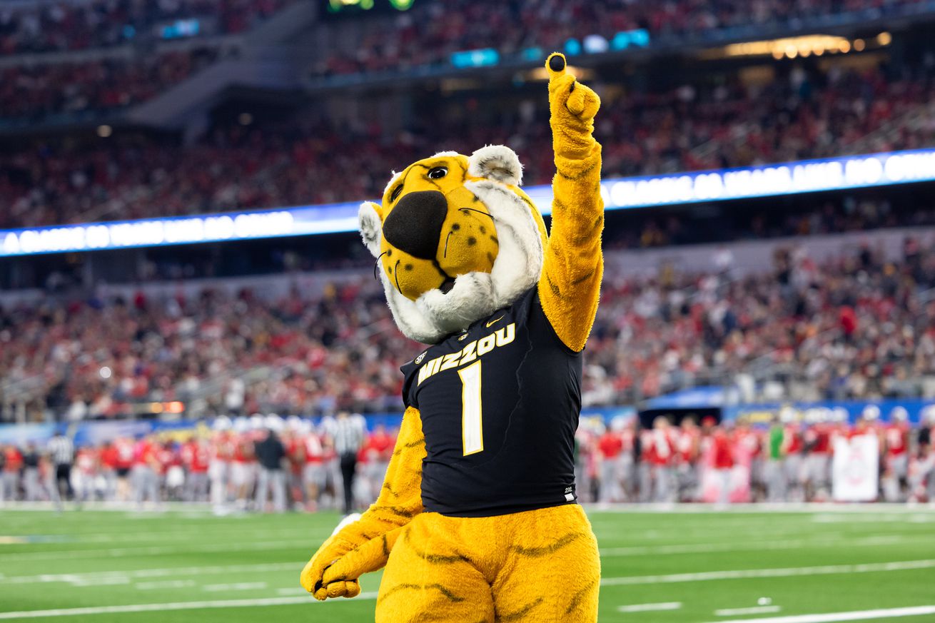 Missouri Tigers mascot Truman the Tiger fires up the crowd during the Goodyear Cotton Bowl Classic football game between the Ohio State Buckeyes and Missouri Tigers on December 29, 2023 at AT&T Stadium in Arlington, TX.