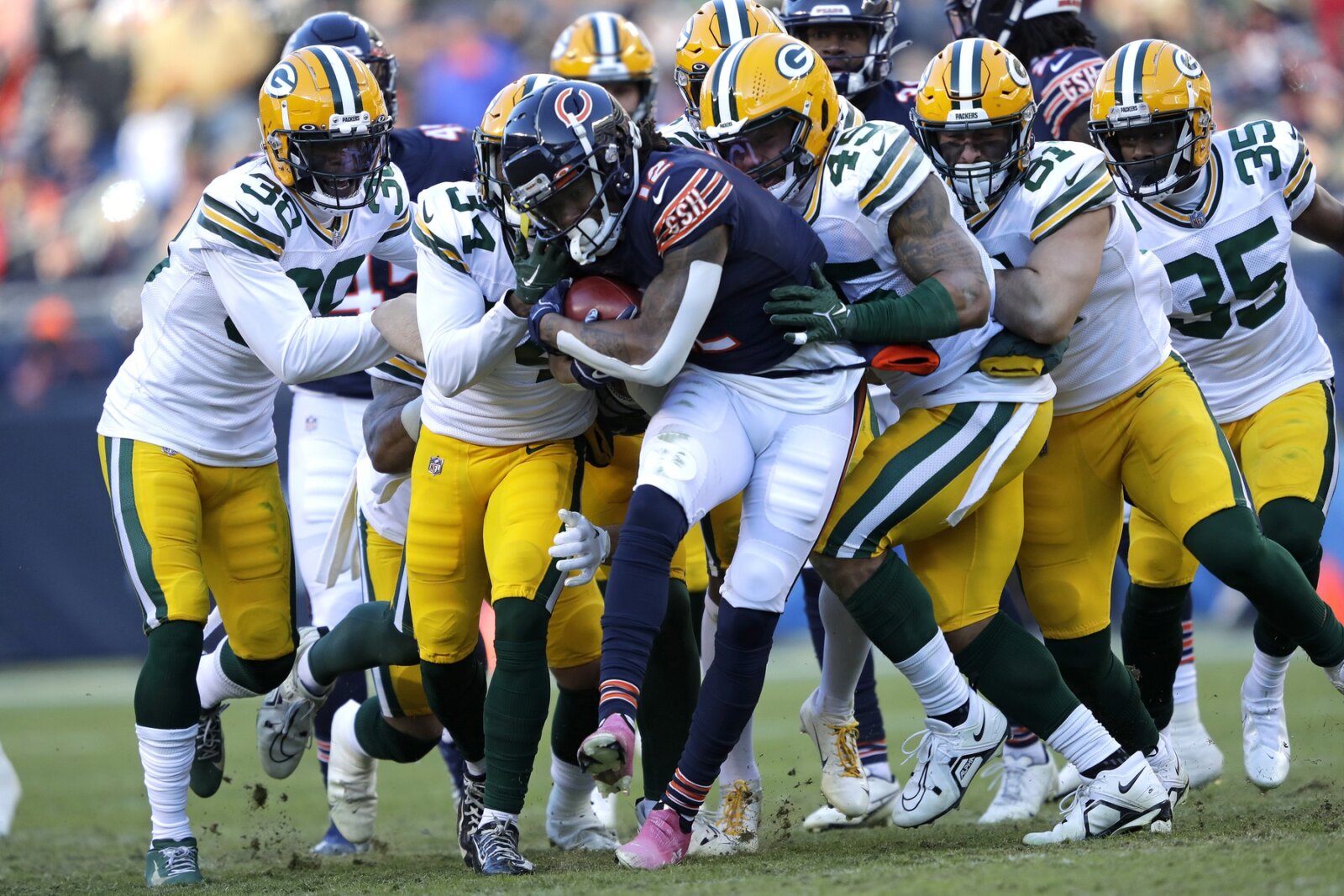 Chicago Bears wide receiver Velus Jones Jr. (12) is stopped by the Green Bay Packers on a kick off return during their football game at Soldier Field.