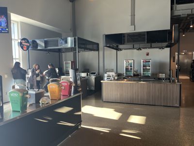 A closed craft beer concession stand and a closed old fashioneds concession stand at Fiserv Forum.