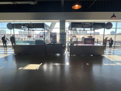 A closed nachos concessions stand and a closed pretzel concessions stand at Fiserv Forum.