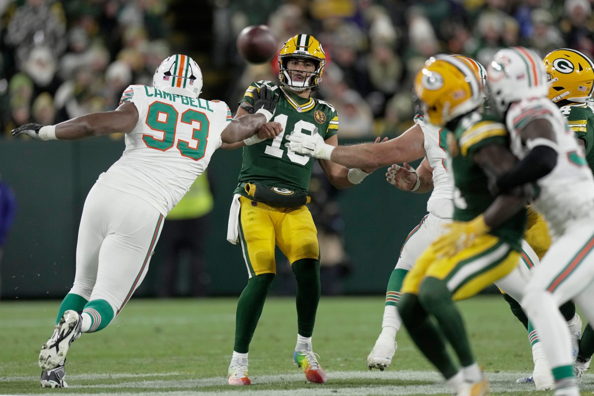 Green Bay Packers' Jordan Love (10) throws a pass to wide receiver Jayden Reed during the second quarter of their game against the Miami Dolphins Thursday