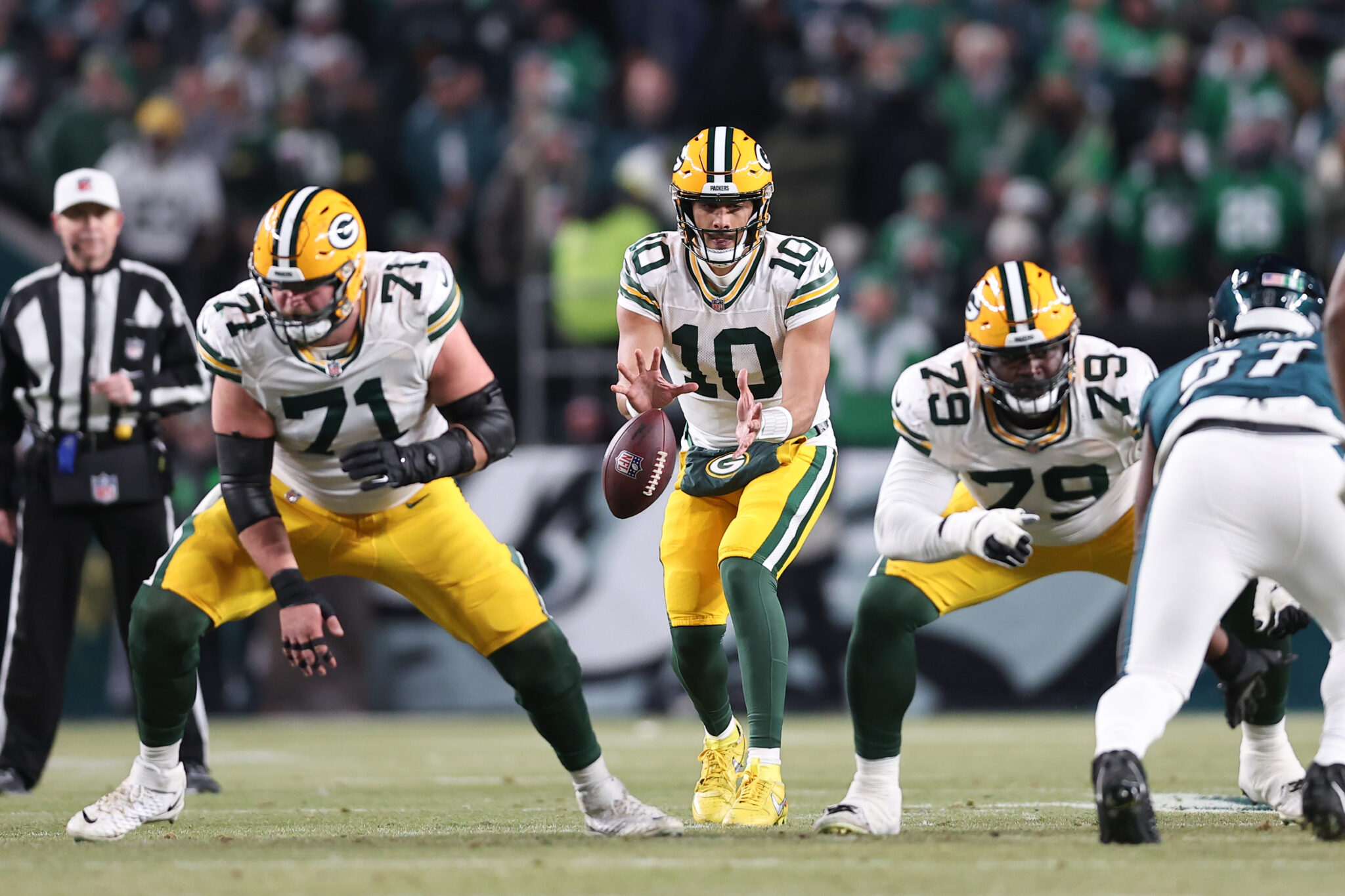 Jordan Love (10) and center Josh Myers (71) in action against the Philadelphia Eagles in an NFC wild card game 2025