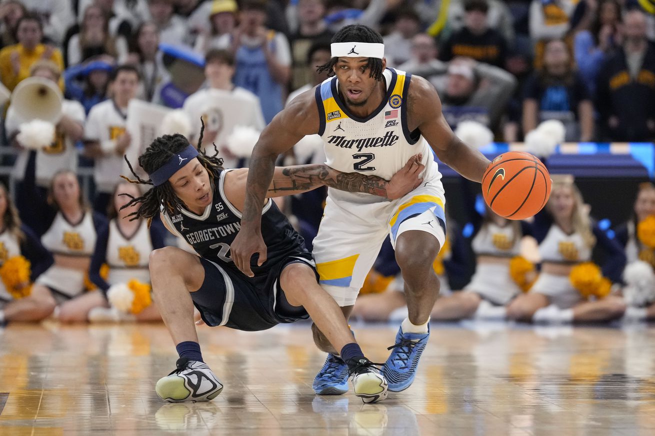 Marquette Golden Eagles guard Chase Ross is fouled by Georgetown Hoyas guard Malik Mack (2) during the second half at Fiserv Forum.