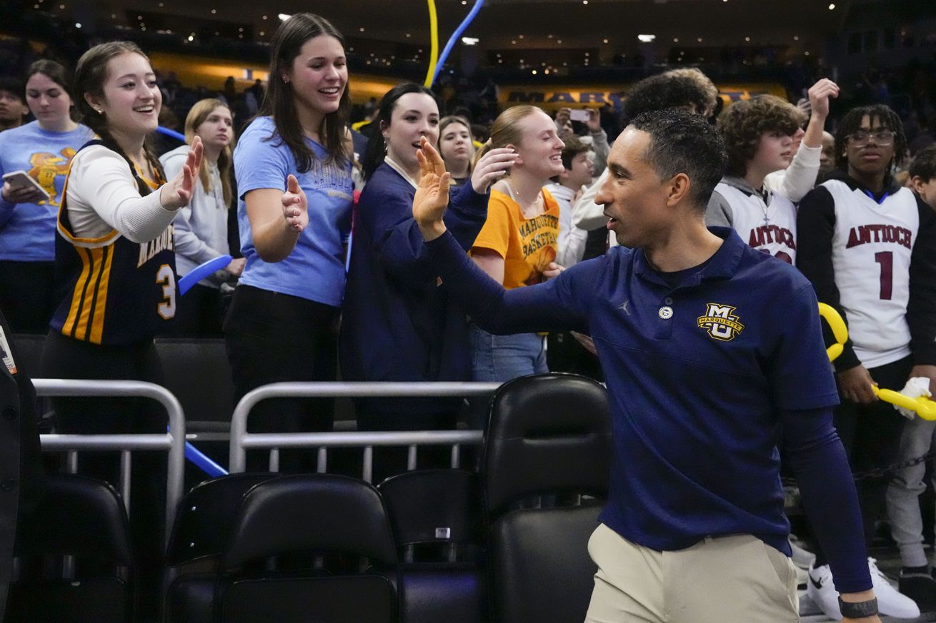 Marquette Golden Eagles head coach Shaka Smart greets fans following the game against the Georgetown Hoyas at Fiserv Forum.