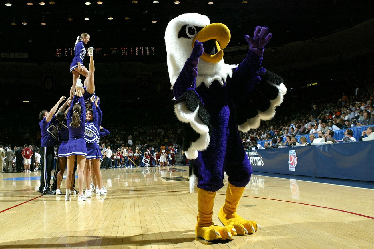 The mascot and cheerleaders of the Niagara Purple Eagles perform during a break in the first half of the first round of the NCAA Men’s Basketball Championship against the Oklahoma Sooners on March 17, 2005 in Mckale Center Arizona, Tucson.