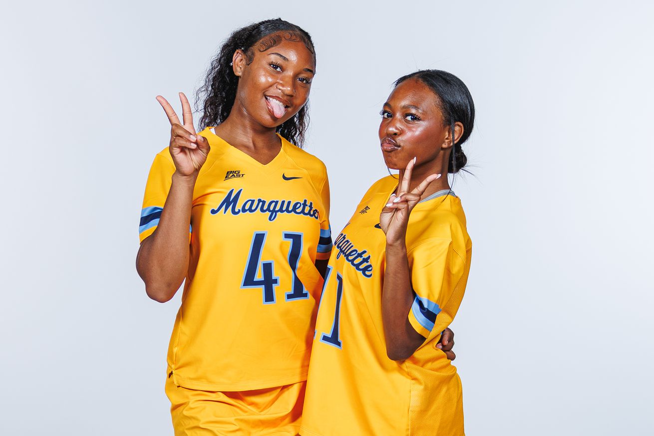 Marquette women’s lacrosse players Addyson Graham and Laila Johnson pose for a photo during team pictures day.