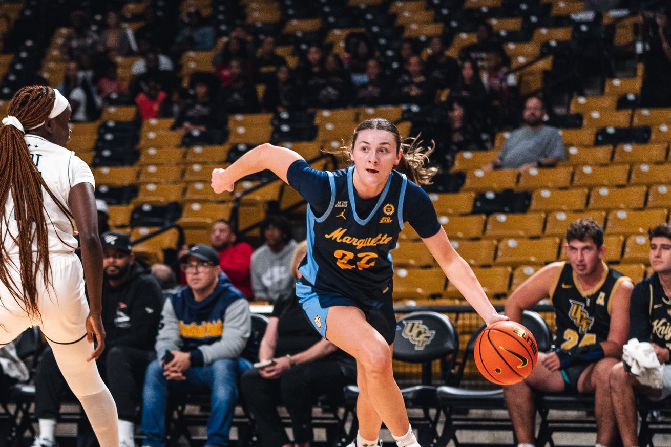 Marquette women’s basketball forward Halle Vice in action with the ball against UCF Knights.