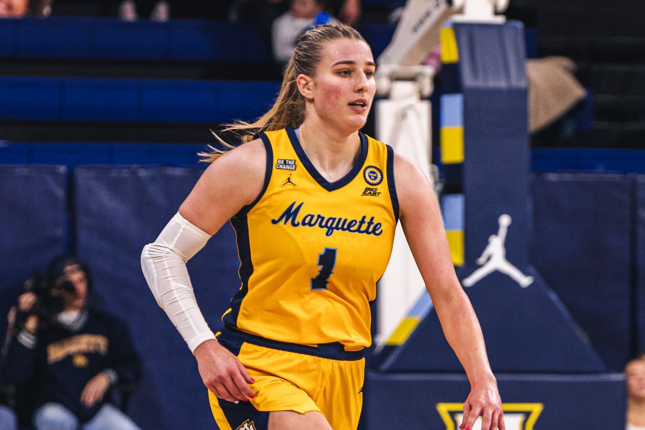 Marquette’s Lee Volker bringing the ball up the court.