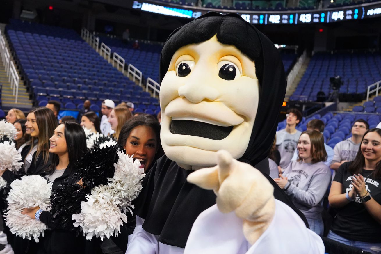 Providence Friars mascot with the cheerleaders during a practice at Greensboro Coliseum. 