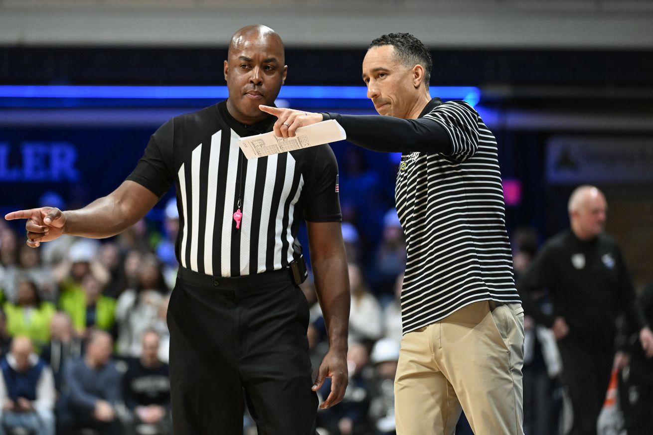 Marquette Golden Eagles head coach Shaka Smart talks with a referee during the first half against the Butler Bulldogs at Hinkle Fieldhouse. 