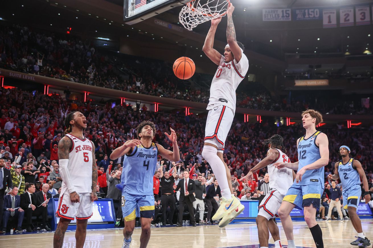 St. John’s Red Storm guard Aaron Scott (0) dunks in the second half against the Marquette Golden Eagles at Madison Square Garden.