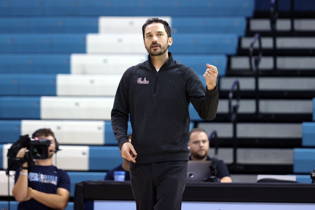 Head coach Tom Mendoza of the University of South Carolina reacts to his team winning a point during a game between South Carolina and North Carolina at Carmichael Arena on September 2, 2022 in Chapel Hill, North Carolina.