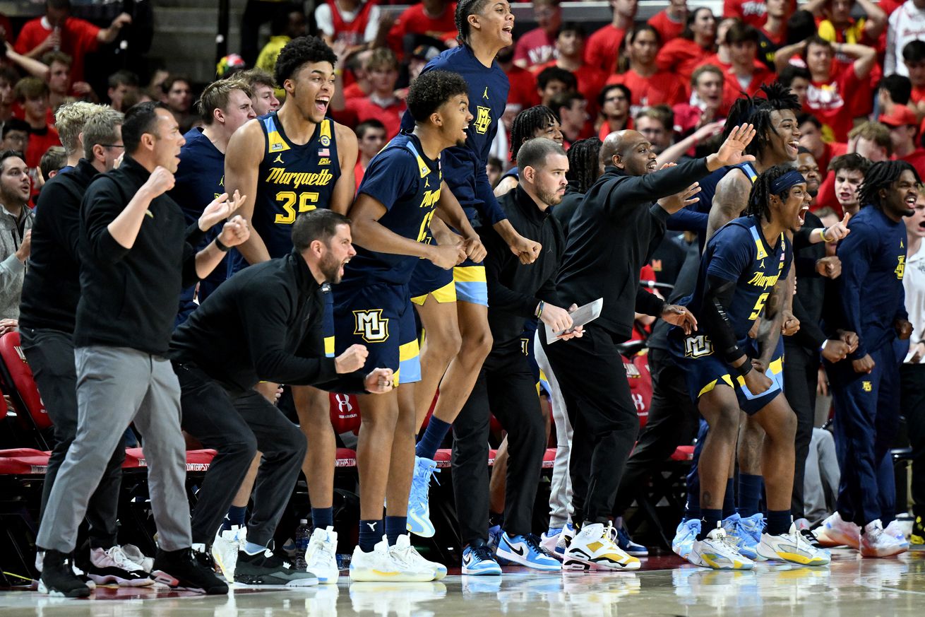 The Marquette Golden Eagles bench celebrates during the second half against the Maryland Terrapins at Xfinity Center on November 15, 2024 in College Park, Maryland.