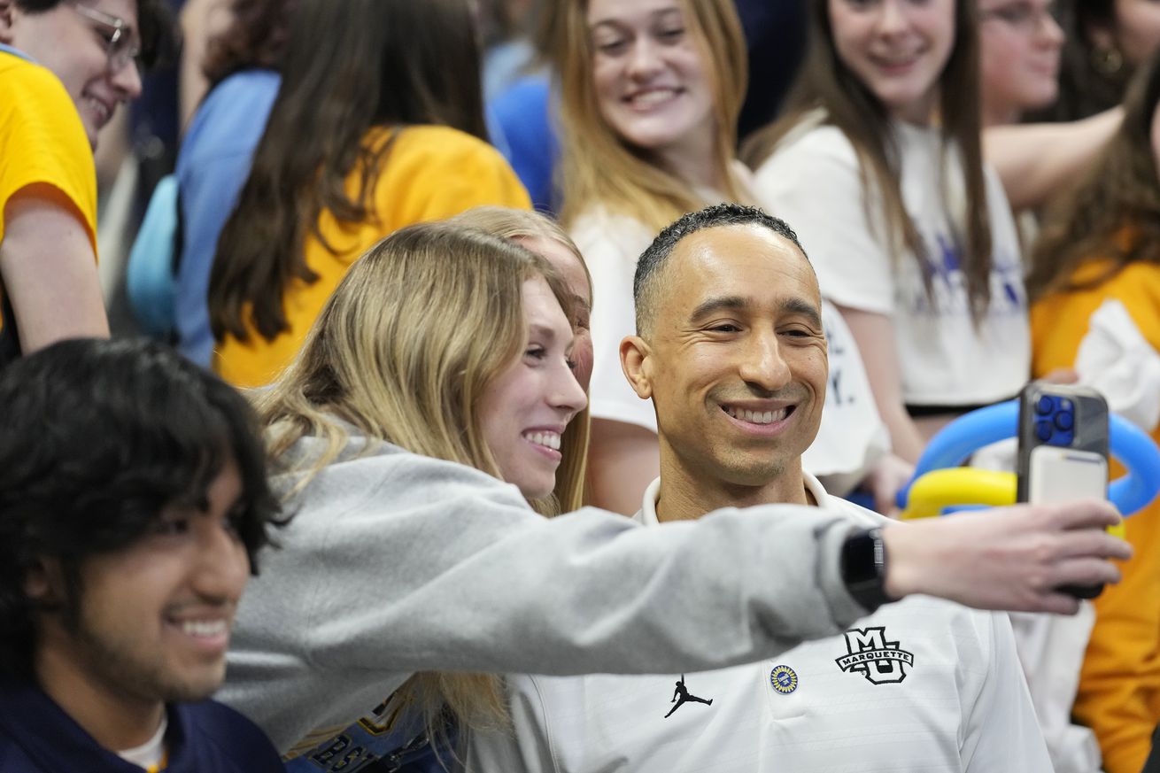 Head coach Shaka Smart of the Marquette Golden Eagles celebrates with fans after defeating the Providence Friars 82-52 at Fiserv Forum on February 25, 2025 in Milwaukee, Wisconsin.